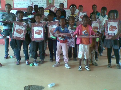 Children receiving goods from Jet Mart